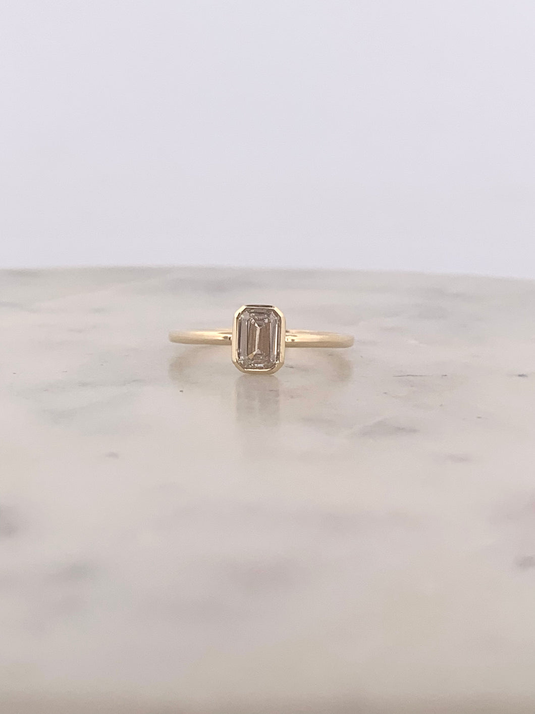 Bezel Set Emerald Engagement